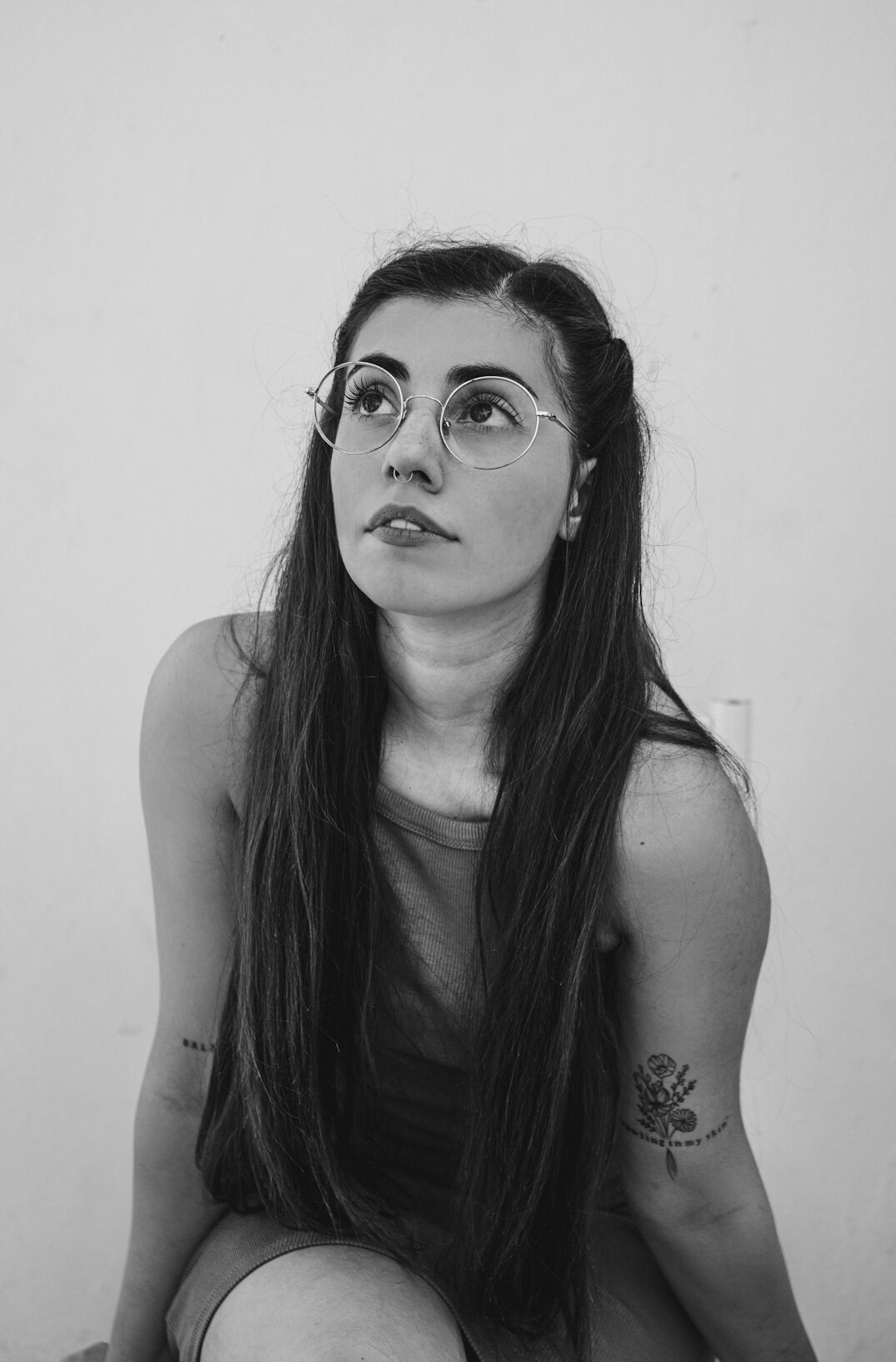 Studio portrait of a young European woman with glasses