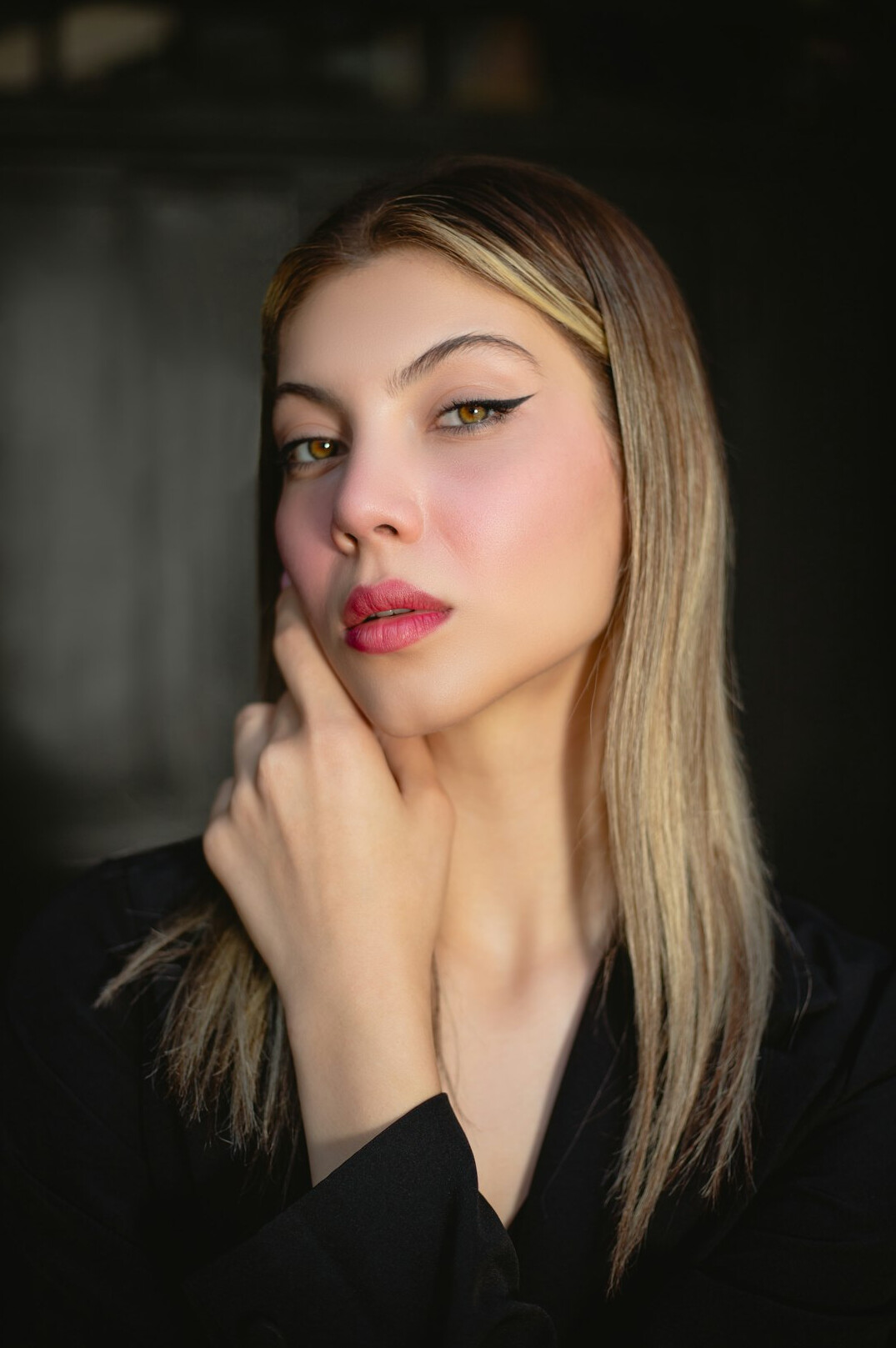 Studio portrait of a European woman with short blonde hair
